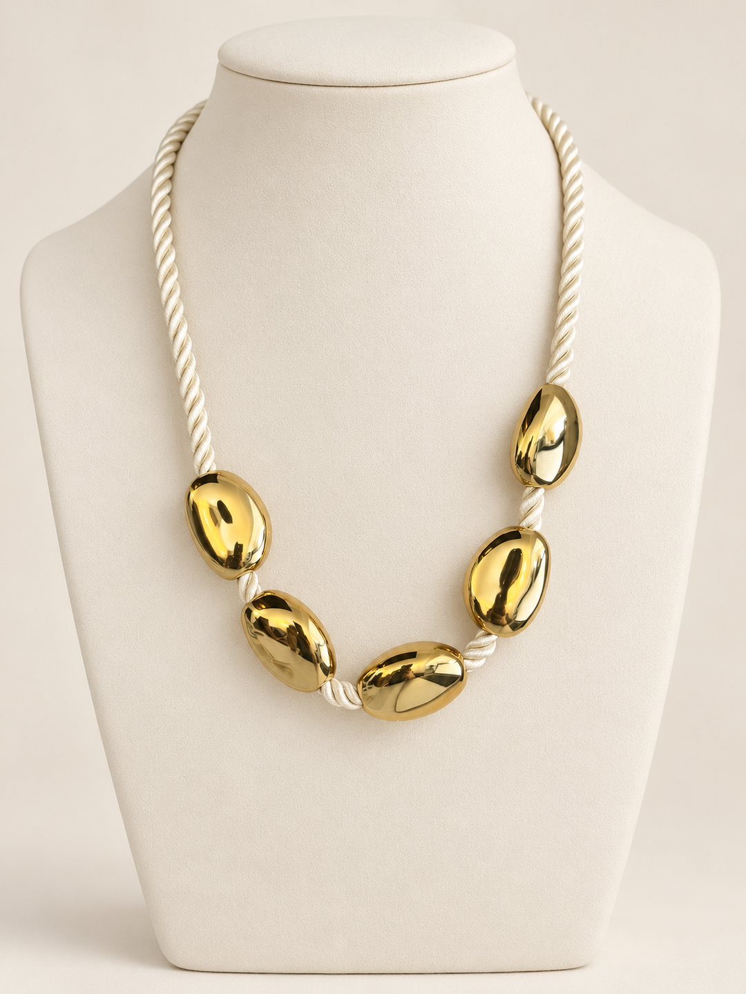 Soléa Necklace — ivory cord and gold-tone oval details